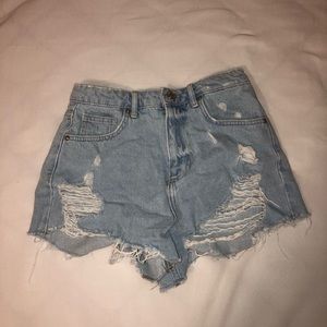 Distressed light blue jeans